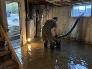 Submersible pumping in a flooded basement by Vault Mold Removal