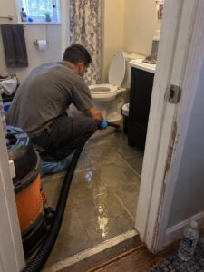 Water extraction after a toilet overflow by Vault Mold Removal