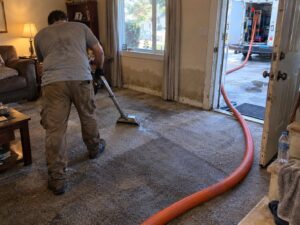 Truck-mount water extraction from flooded carpet by Vault Mold Removal