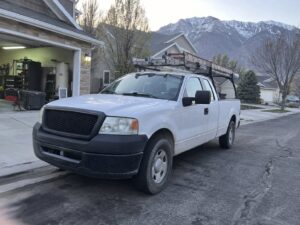 Work truck parked on a residential street in Provo Ut by Vault Mold Removal